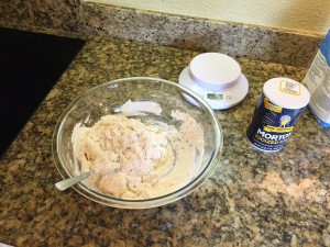 Flour and liquid mixed with spoon.